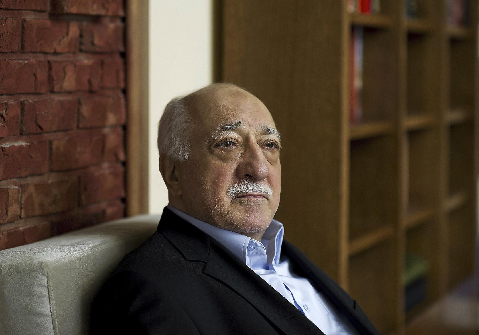 FILE - In this March 15, 2014 file photo, Turkish Islamic preacher Fethullah Gulen is pictured at his residence in Saylorsburg, Pennsylvania, United States. Police conducted raids in a dozen Turkish cities Sunday, detaining at least 24 people — including journalists, TV producers and police — known to be close to a movement led by a U.S.-based moderate Islamic cleric who is a strong critic of President Recep Tayyip Erdogan. It was the latest crackdown on cleric Fethullah Gulen's movement, which the government has accused of orchestrating an alleged plot to try to bring it down. (AP Photo/Selahattin Sevi, File)