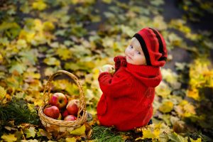 red-hat-and-red-jacket-cute-baby-in-autumn
