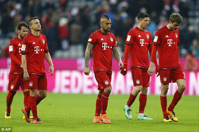 31c8c91c00000578-0-bayern_munich_players_leave_the_field_dejected_following_their_2-a-119_1457013851831