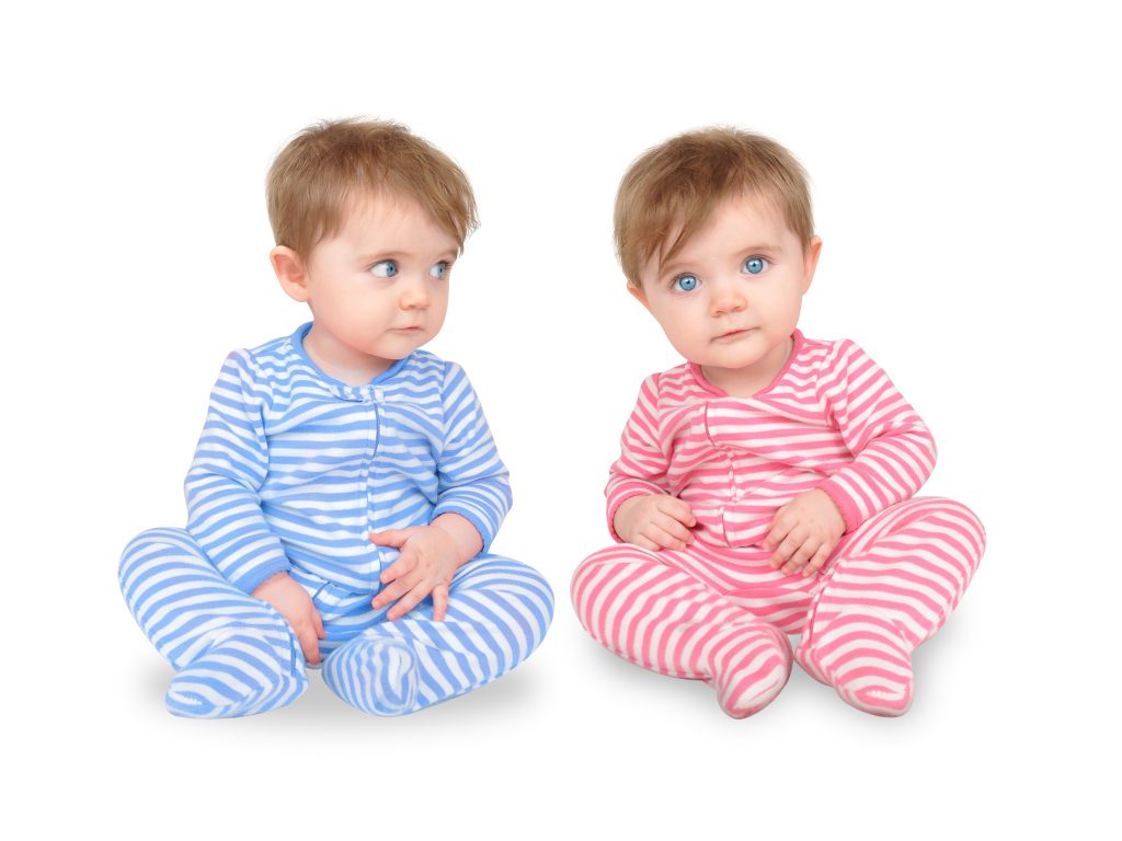 Curious Twin Babies on White