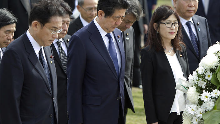 From left, Sal Miwa, of the Japan-America Society of Hawaii, Japanese Prime Minister Shinzo Abe, Japanese Defense Minister Tomomi Inada, and Japan’s Deputy Chief Cabinet Secretary Koichi Hagiuda bow at the Ehime Maru Memorial at Kakaako Waterfront Park, Monday, Dec. 26, 2016, in Honolulu. The memorial is dedicated to the victims of a 2001 deadly collision off the coast of Hawaii between the Ehime Maru, a fisheries training vessel, and a U.S. naval submarine. Abe plans to visit Pearl Harbor with U.S. President Barack Obama Tuesday. (AP Photo/Marco Garcia)