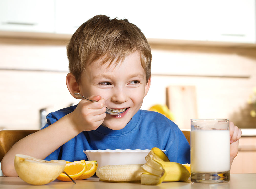 little-boy-eating-a-healthy-breakfast